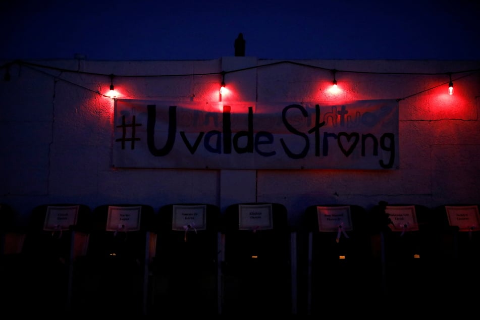 Empty chairs with names of the victims of the Robb Elementary School mass shooting during a vigil in Uvalde, Texas.