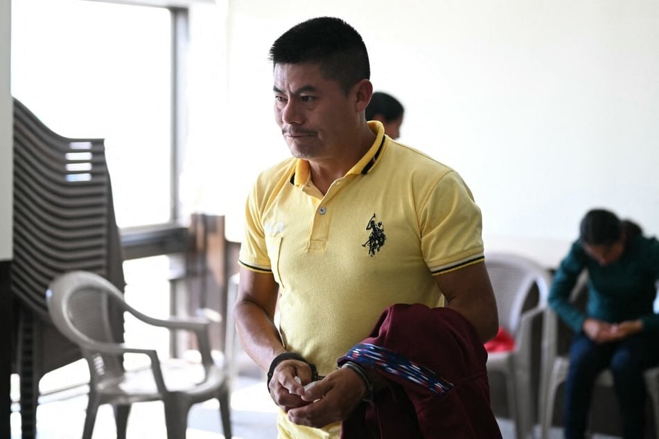 Rigoberto Miranda arrives handcuffed at a court hearing in Guatemala City on September 11, 2024.