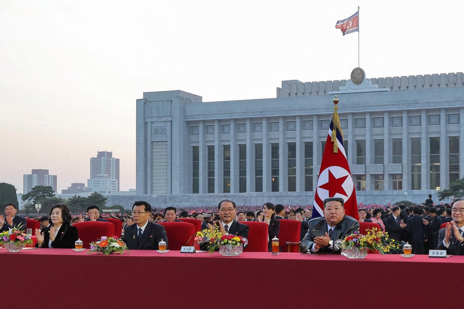 North Korean leader Kim Jong-said (2nd from r.) declared his country's status as a nuclear power "irreversible" in an address reported by state media.