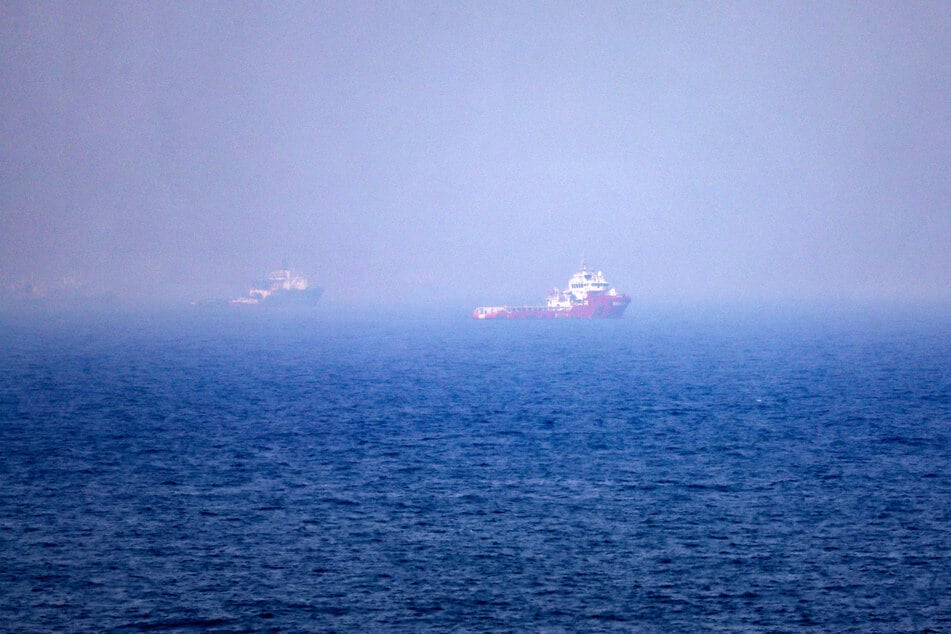 This picture shows ships sailing near the Strait of Hormuz off the eastern coast of the United Arab Emirates at Khor Fakkan on July 13, 2026.