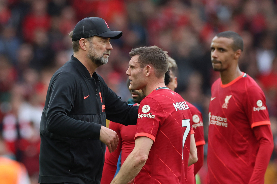 Jürgen Klopp consoles his players after they come up short in the title race.