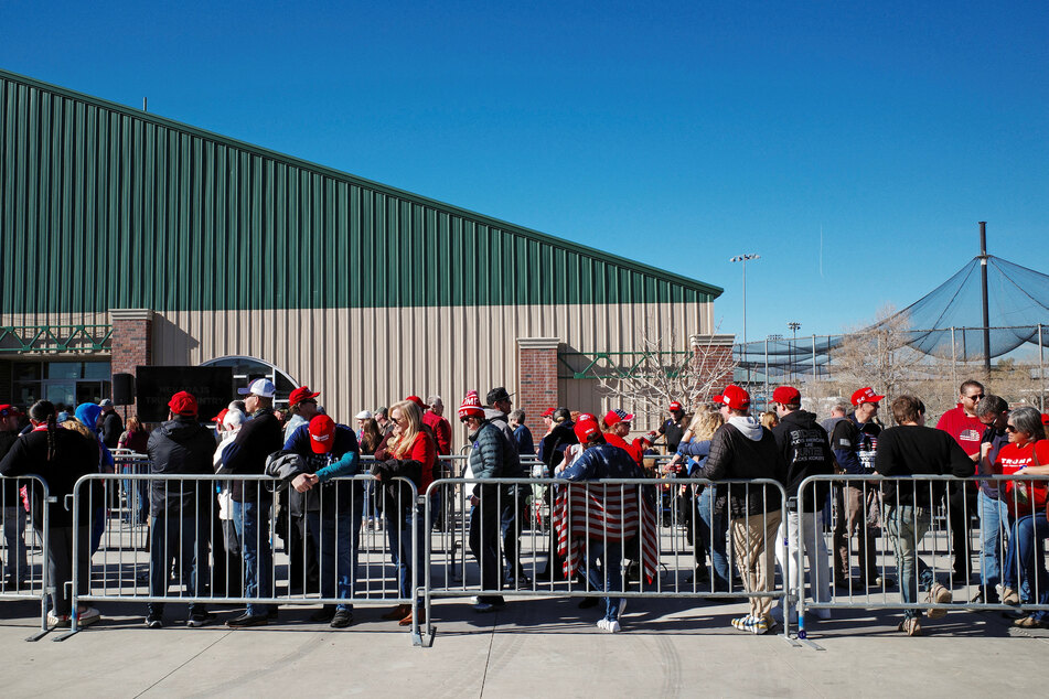 Supporters wait in line outside the venue where Donald Trump is slated to speak at a campaign rally ahead of the Republican caucus in Las Vegas, Nevada.