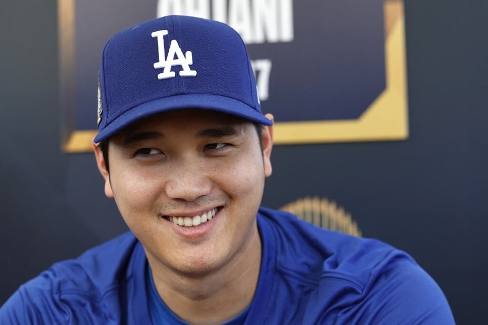 Shohei Ohtani of the Los Angeles Dodgers speaks to media during a workout day ahead of Game 1 of the 2024 World Series at Dodger Stadium.