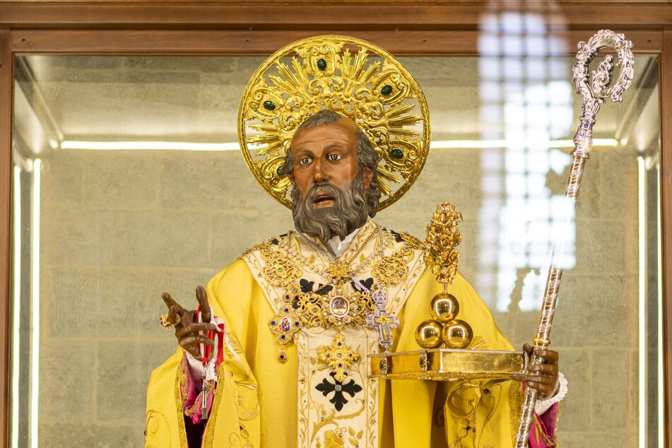 The statue of San Nicola is located in the Basilica of San Nicola in Bari.