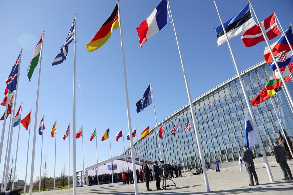 The Finnish flag is set to be hoisted in front of NATO headquarters after it became the 31st member of the alliance.