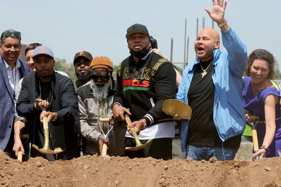 In May 2021, the Universal Hip Hop Museum's executive director Rocky Bucano (l.), kicked off a groundbreaking ceremony (from l. to r.) with Nas, LL Cool J, and Fat Joe in Bronx Point.