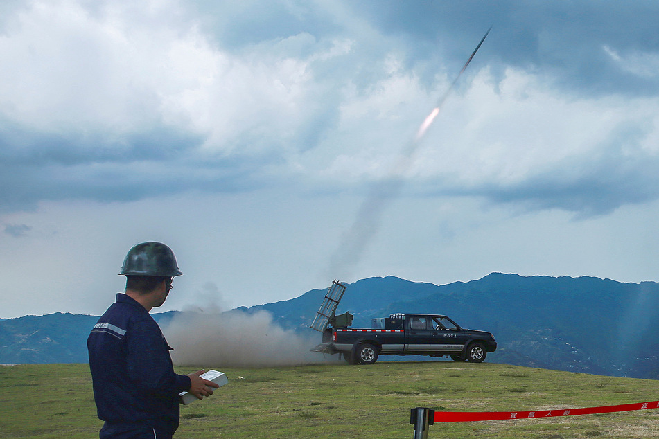 China is shooting rockets at the sky, in the hopes of making more rain.