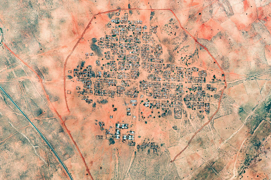 A satellite image by Vantor taken on October 25, 2025, and made available on October 31 shows a berm being constructed in Kinin Village near El-Fasher, Sudan.