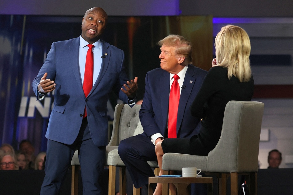 Tim Scott (l.) praising Donald Trump during a Fox News town hall event in Greenville, South Carolina on Tuesday, February 20, 2024.