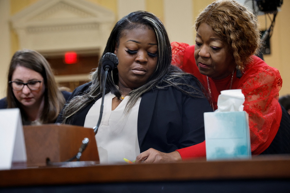 Wandrea "Shaye" Moss (c.) and her mother, Ruby Freeman, were both poll workers in Fulton County on Election Day 2020.