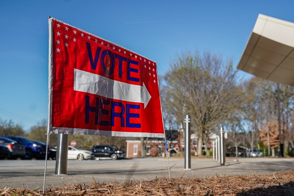 A "Vote Here" signs directs voters to a precinct during the presidential primary elections in Atlanta, Georgia, on March 12, 2024.