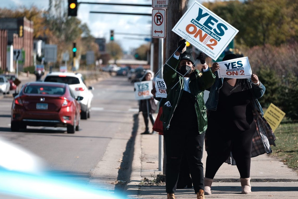 Minneapolis residents hit the streets in support of the Question 2 charter amendment.