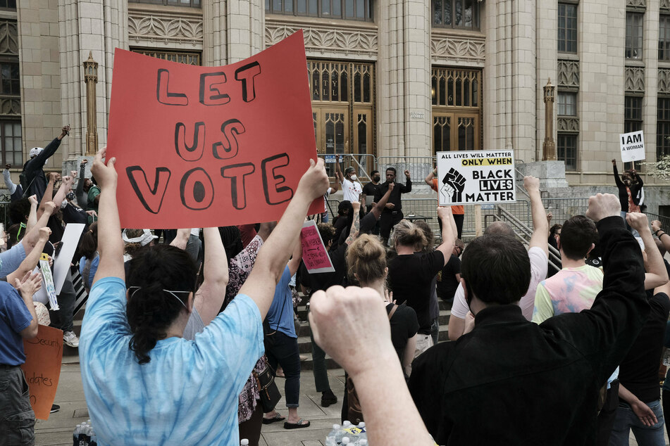 Georgians protested the restrictive voting law signed by Governor Brian Kemp in March 2021.