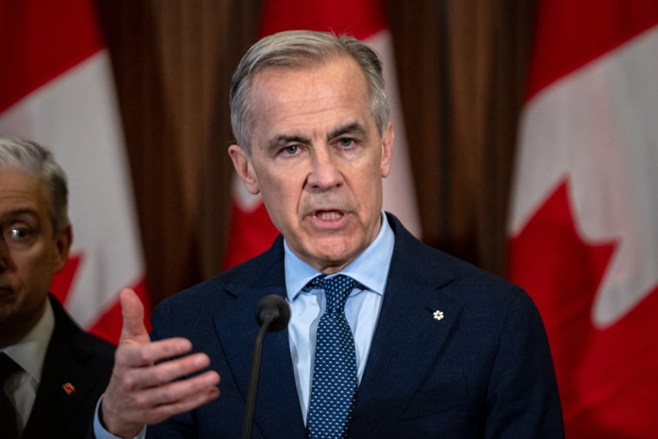 Canadian Prime Minister Mark Carney vowed to protect the country's economy from US threats after his Liberal party won a majority in Parliament.