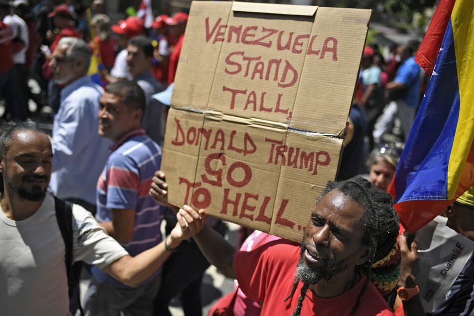 Venezuelan protesters rally against US sanctions in Caracas on August 7, 2019.
