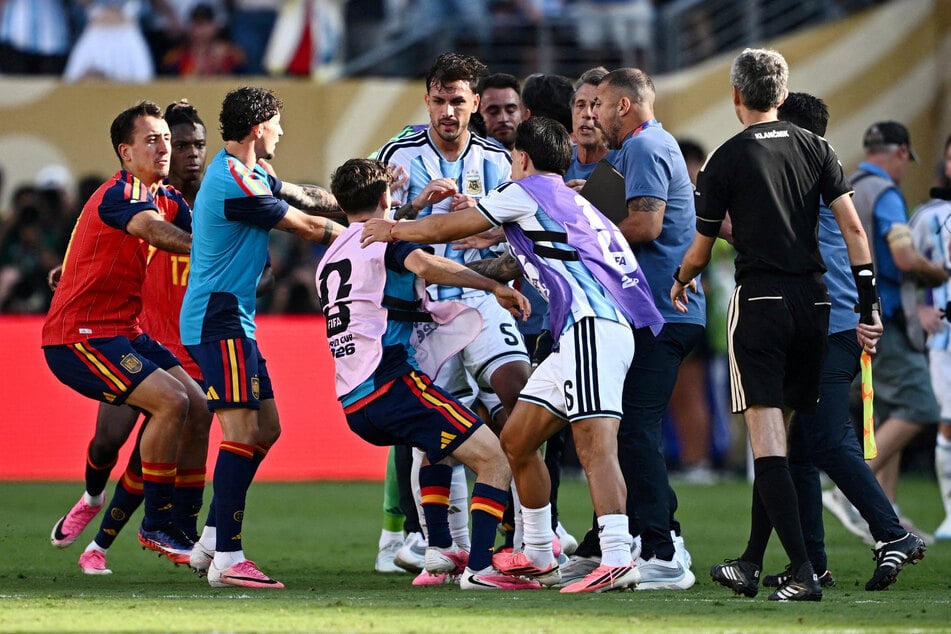 Argentina's Leandro Paredes and Lisandro Martinez clash with Spain's Gavi after the 2026 World Cup Final.