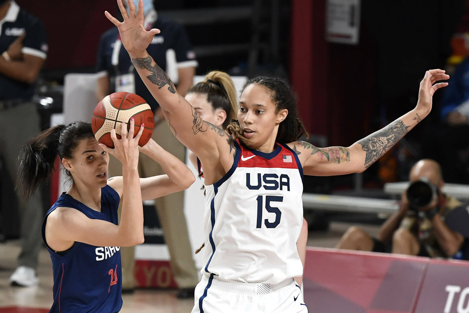 Brittney Griner (r.) defends against Serbia's Dragana Stankovic during the women's basketball semifinal game at the Tokyo 2020 Olympics on Friday.