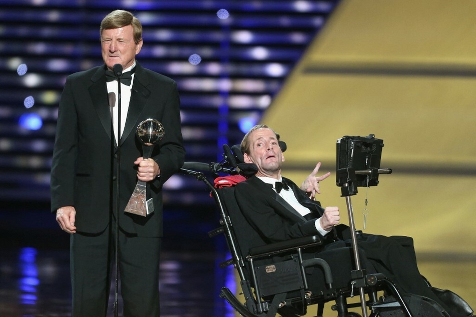 Dick Hoyt (l.) and his son Rick accepting the Jimmy V Perseverance award onstage at the 2013 ESPY Awards.
