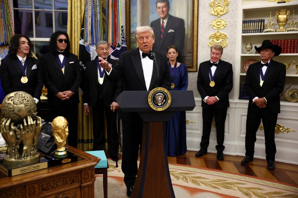 President Donald Trump participates in the Kennedy Center Honors medal presentation in the Oval Office of the White House on December 6, 2025.