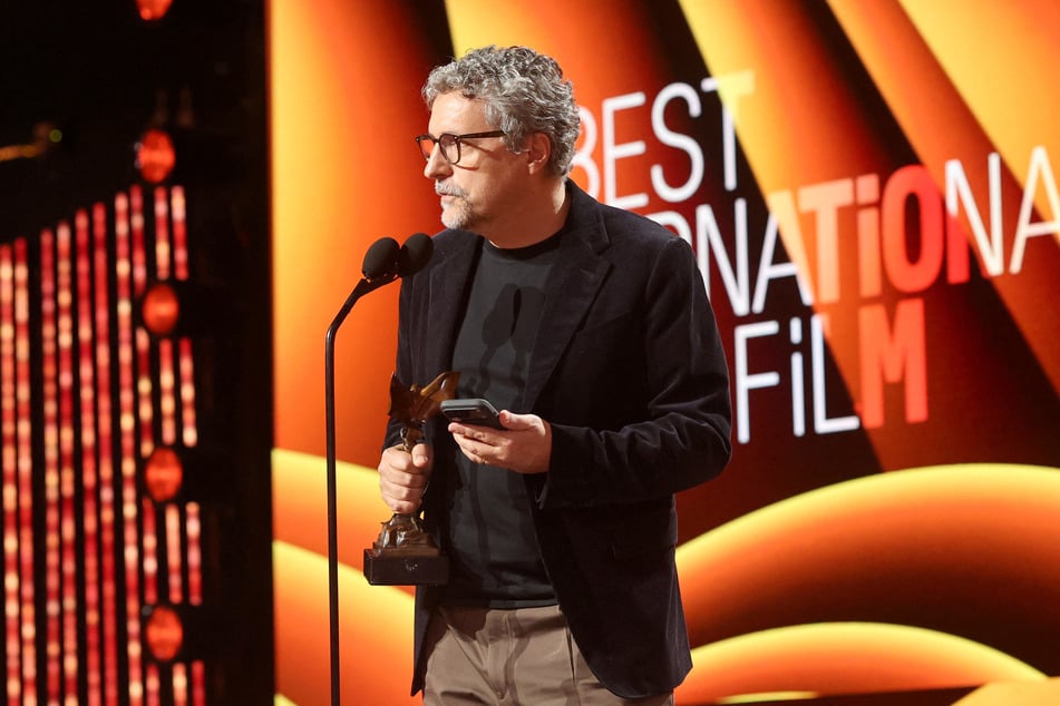 Kleber Mendonça Filho accepts the Best International Film award for The Secret Agent onstage during the Film Independent Spirit Awards on February 15, 2026.