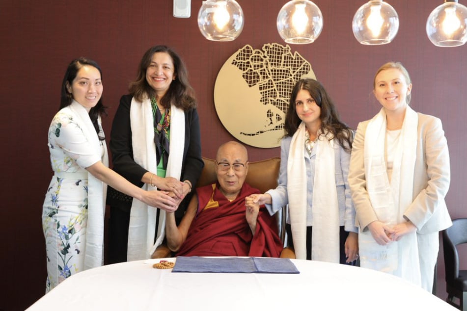 The Dalai Lama (c.) met with senior State Department official Uzra Zeya (2nd form l.) during a visit to New York.