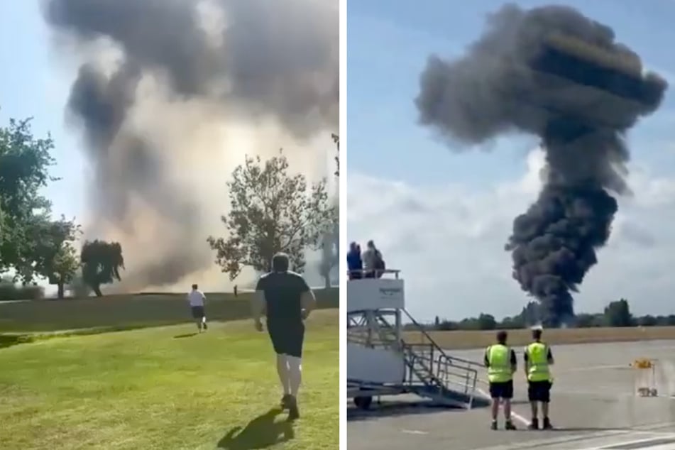 Schwarzer Rauch steigt nach dem Absturz eines Kleinflugzeugs über dem Southend Airport in England empor.