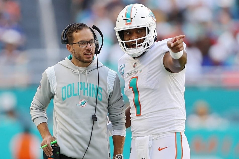 Head coach Mike McDaniel speaks with quarterback Tua Tagovailoa of the Miami Dolphins in the fourth quarter of the game against the Buffalo Bills at Hard Rock Stadium.