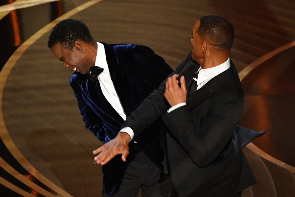 Will Smith (r.) slaps Chris Rock onstage during the 94th Oscars at the Dolby Theatre in Hollywood, California, on March 27, 2022.