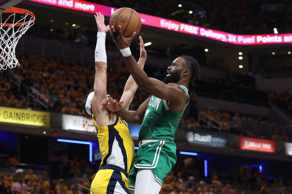 Boston Celtics guard Jaylen Brown shoots the ball against Indiana Pacers guard Andrew Nembhard during the Eastern Conference Finals in the 2024 NBA Playoffs.