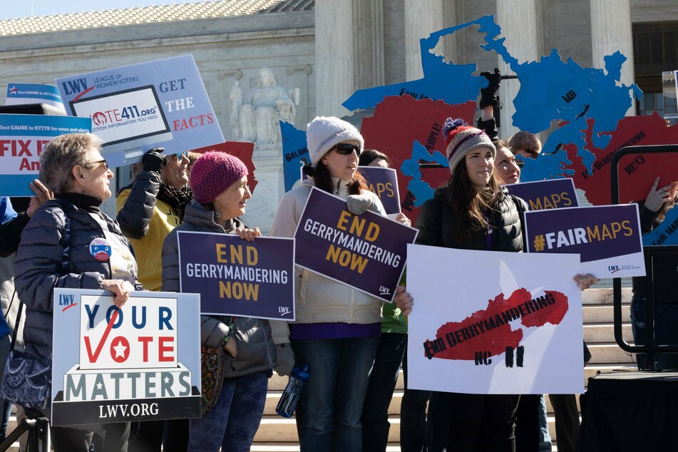 Protesters gathered outside the Supreme Court call for an end to partisan gerrymandering.