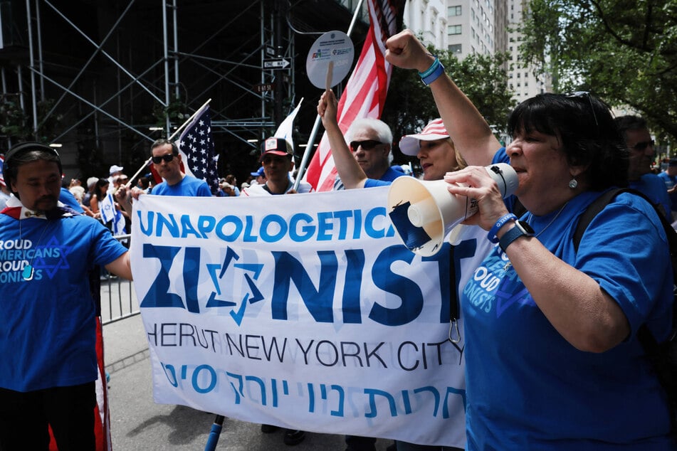 People wearing t-shirts declaring themselves "proud Zionists" participate in the annual Israel Day parade in New York City on May 31, 2026.