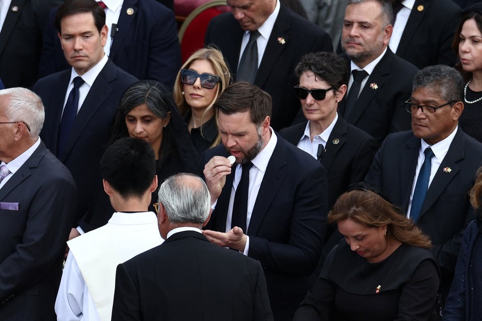 Vice President JD Vance receives the Eucharist during the inaugural Mass of Pope Leo XIV in St. Peter’s Square at the Vatican on May 18, 2025.