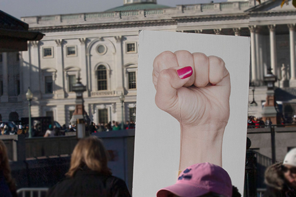 Demonstrators stand outside the US Capitol building as the Supreme Court heard oral arguments for the Dobbs v. Jackson Women's Health Organization case.