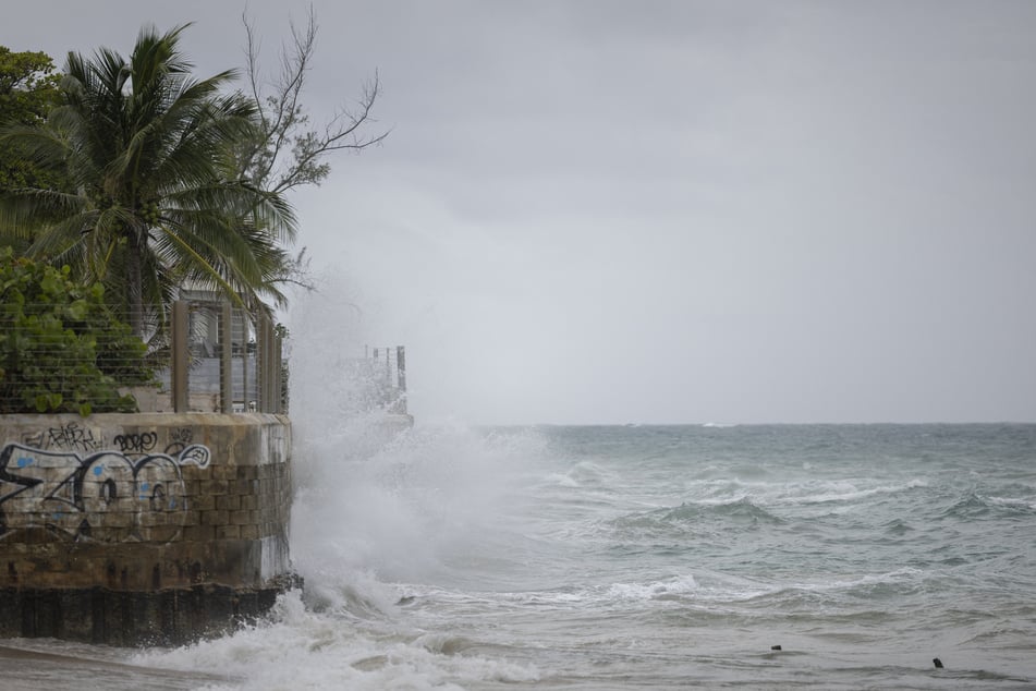Waves hit a structure as Hurricane Erin approaches in San Juan, Puerto Rico, on Saturday.
