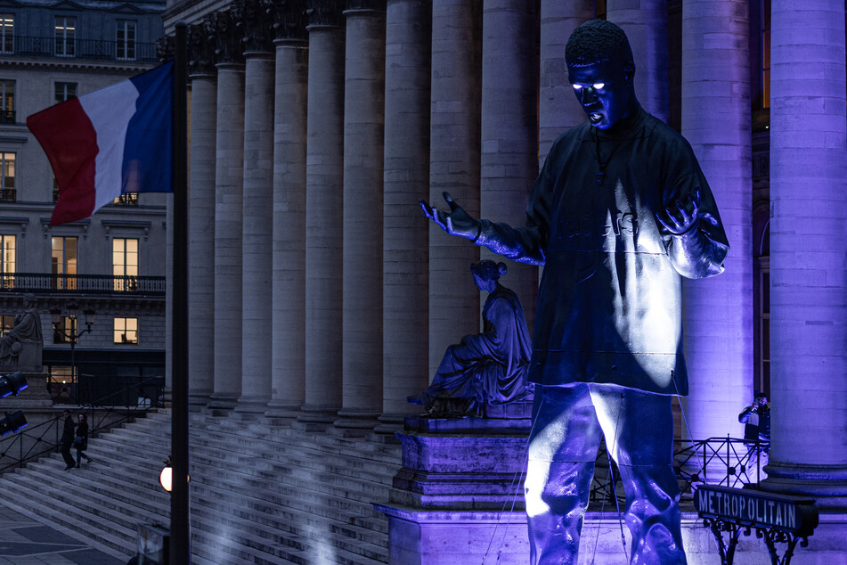 A 33-foot high statue of rapper and actor Scott Ramon Seguro Mescudi, aka Kid Cudi in front of the Palais Brongniart in Paris, on Friday to mark the release of his new album Insano.