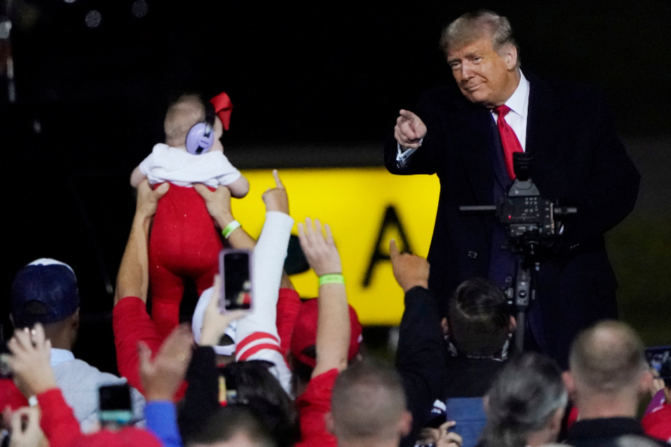 Fayetteville: Donald Trump finishes his speech at a campaign rally at a regional airport in North Carolina.