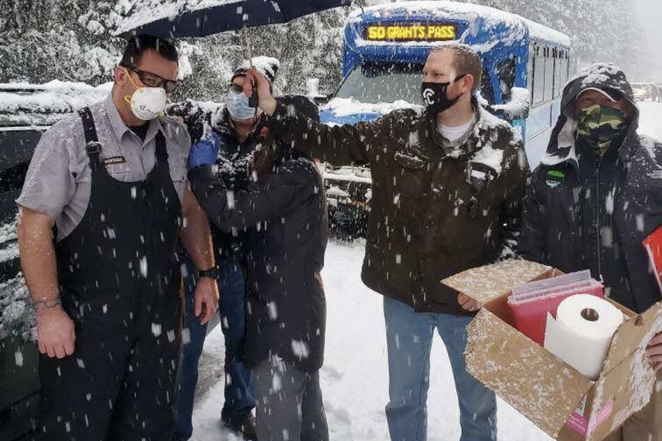 Healthcare workers stuck in a snowstorm vaccinate stranded drivers