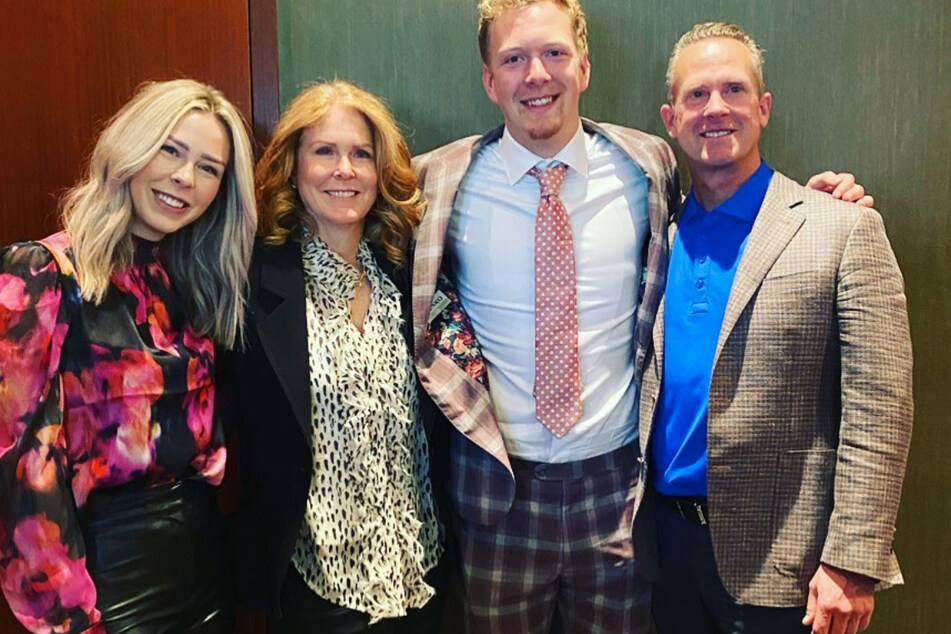 Luke Prokov (2nd from r.) with his family after singing his first NHL contract.