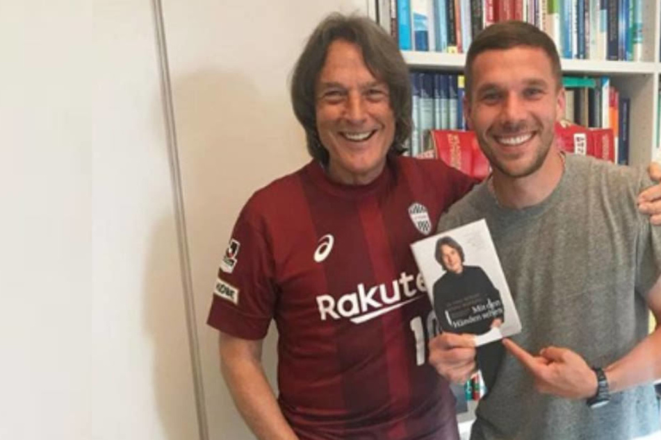 Beste Laune: Dr. Hans-Wilhelm Müller-Wohlfahrt und Lukas Podolski.