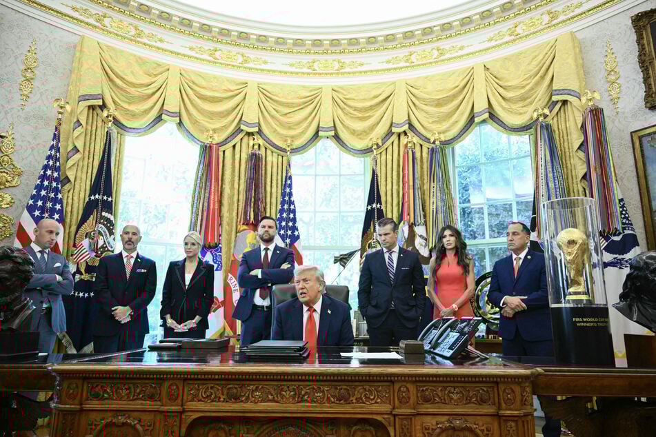 President Donald Trump speaks to the press after signing an executive order that aims to end cashless bail, in the Oval Office of the White House in Washington, DC on Monday. Also pictured (L-R): Deputy Chief of Staff Stephen Miller, Administrator Drug Enforcement Administration Terry Cole, US Attorney General Pam Bondi, Vice President JD Vance, Defense Secretary Pete Hegseth, Secretary of Homeland Security Kristi Noem, and Director of the US Marshals Service Gadyaces S. Serralta.