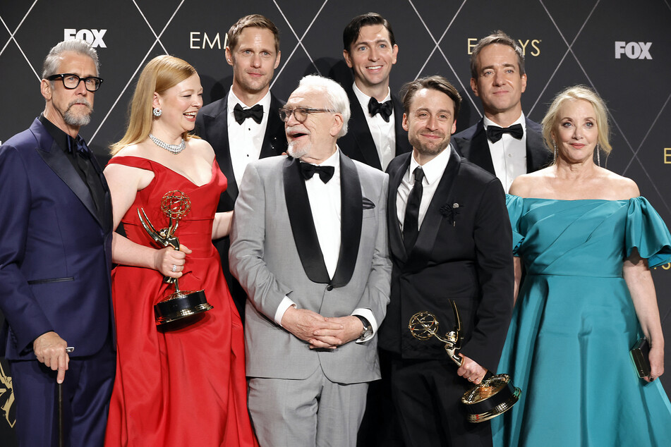 The stars of Succession celebrate a successful win at the delayed Emmy Awards, where the show's final season grabbed six prizes.