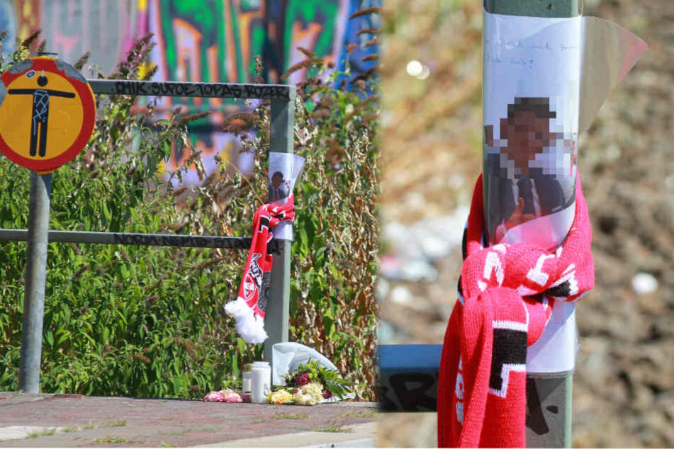 Die Angehörigen der Opfer haben an der Unfallstelle Blumen, Kerzen und Gendenkfotos niedergelegt.