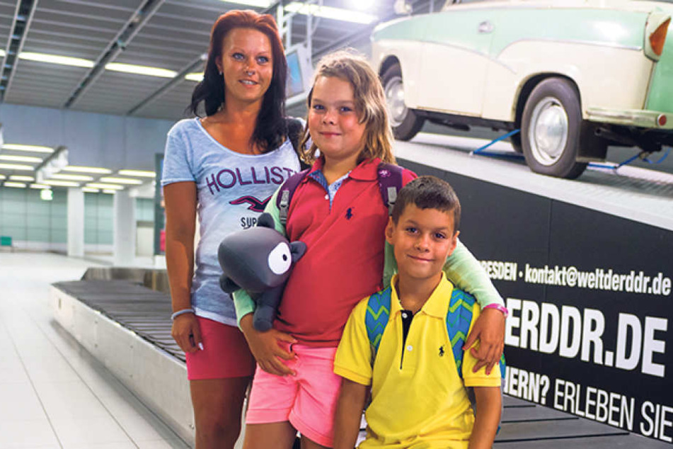 Die Dresdnerin Julia Drobisch (30) mit ihren Kindern Melina (8) und
Maximilian (7).