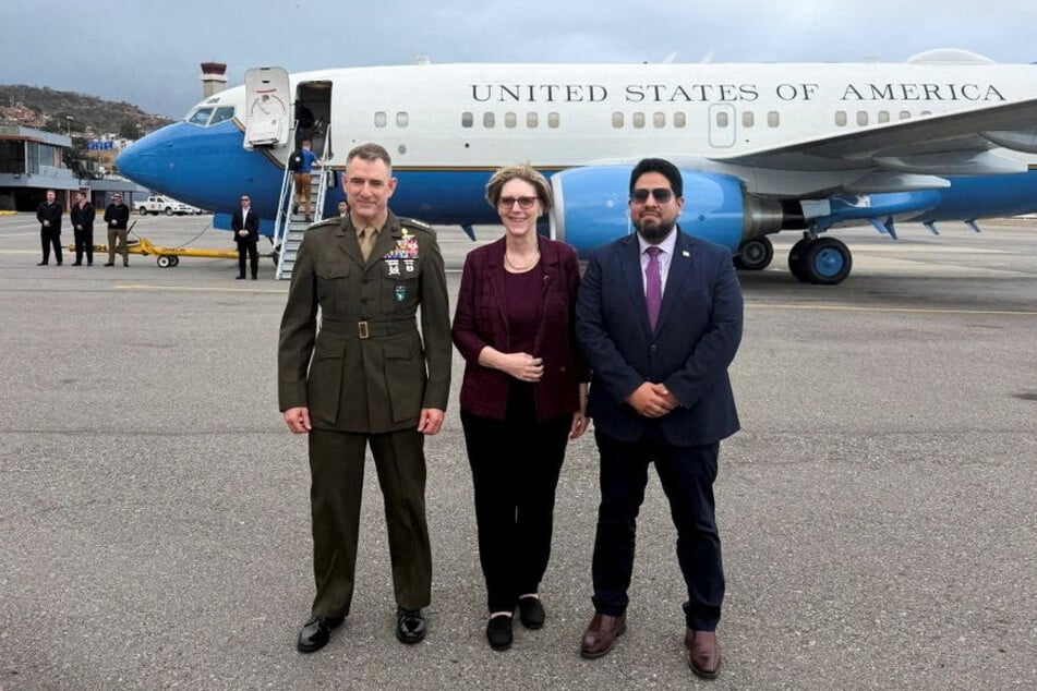 From l. to r.: US Southern Command chief Francis L. Donovan, US Charge d'Affaires to Venezuela Laura Farnsworth Dogu, and senior Pentagon official Joseph M. Humire pose for a photo in Caracas, Venezuela, on February 18, 2026.