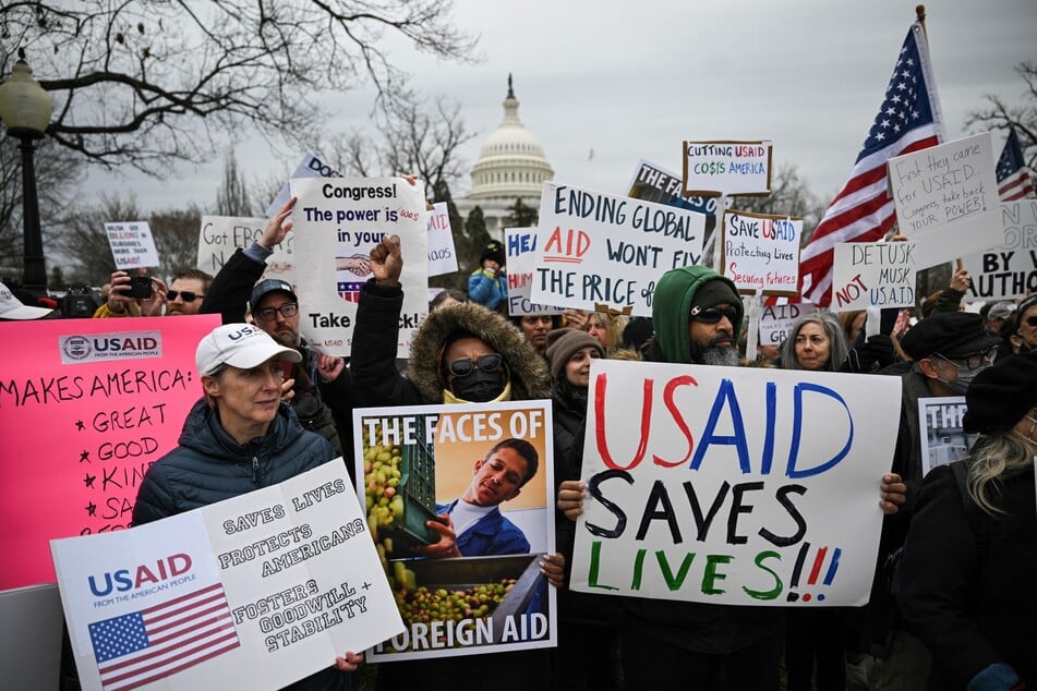 People protest against the administration of US President Donald Trump's decision to virtually shut down the US Agency for International Development (USAID) at the US Capitol in Washington, DC, on February 5, 2025.