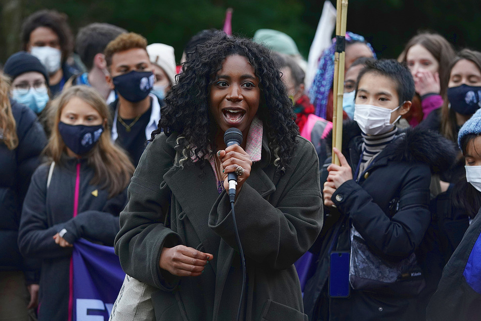 Climate activist Dominique Palmer speaks during The Avaaz campaign's demonstration by the River Clyde in front the Scottish Event Campus where Cop26 is being held.