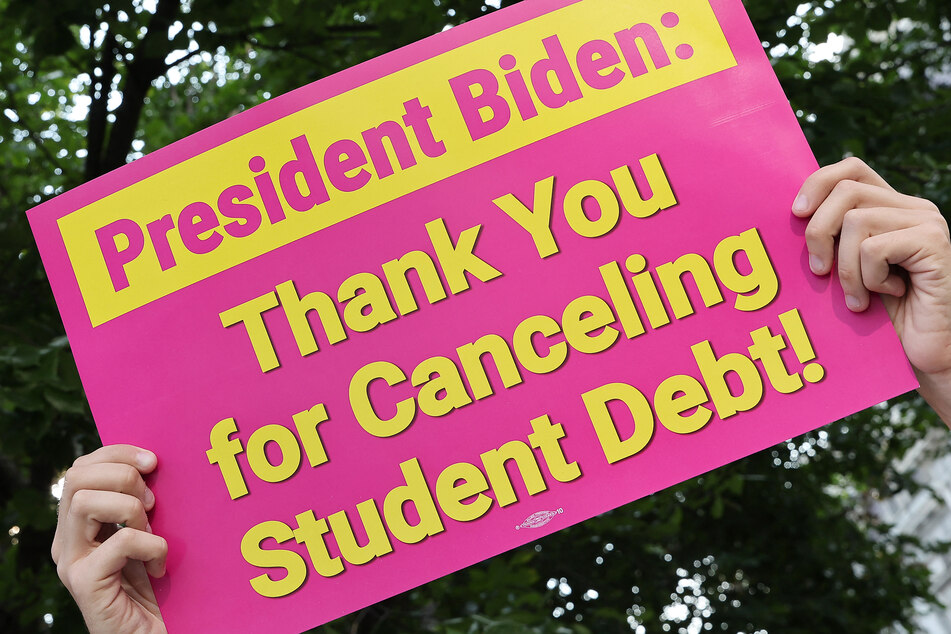 Student loan borrowers celebrate at a rally in front of The White House on August 25.