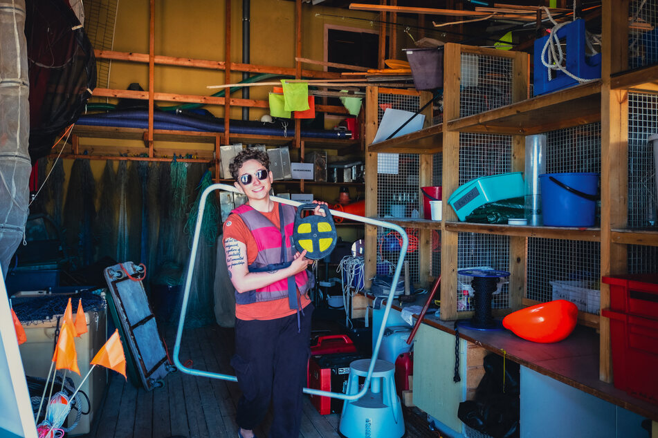 Doctoral researcher Margaret Williamson collects instruments for her research in the dock area at the Tvarminne Zoological Station (TSZ), the largest marine research station in the Baltic Sea, in Hanko, Finland on June 26, 2024.