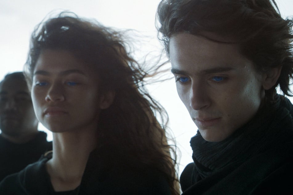 Timothee Chalamet (r) and Zendaya (l) star as Paul Atreides and Chani, respectively, in the 2021 film, Dune.