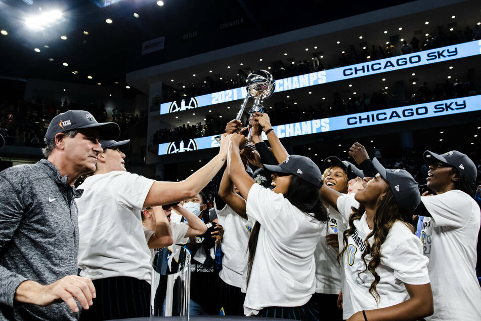 Chicago Sky players lift the WNBA championship trophy after winning the title on Sunday.